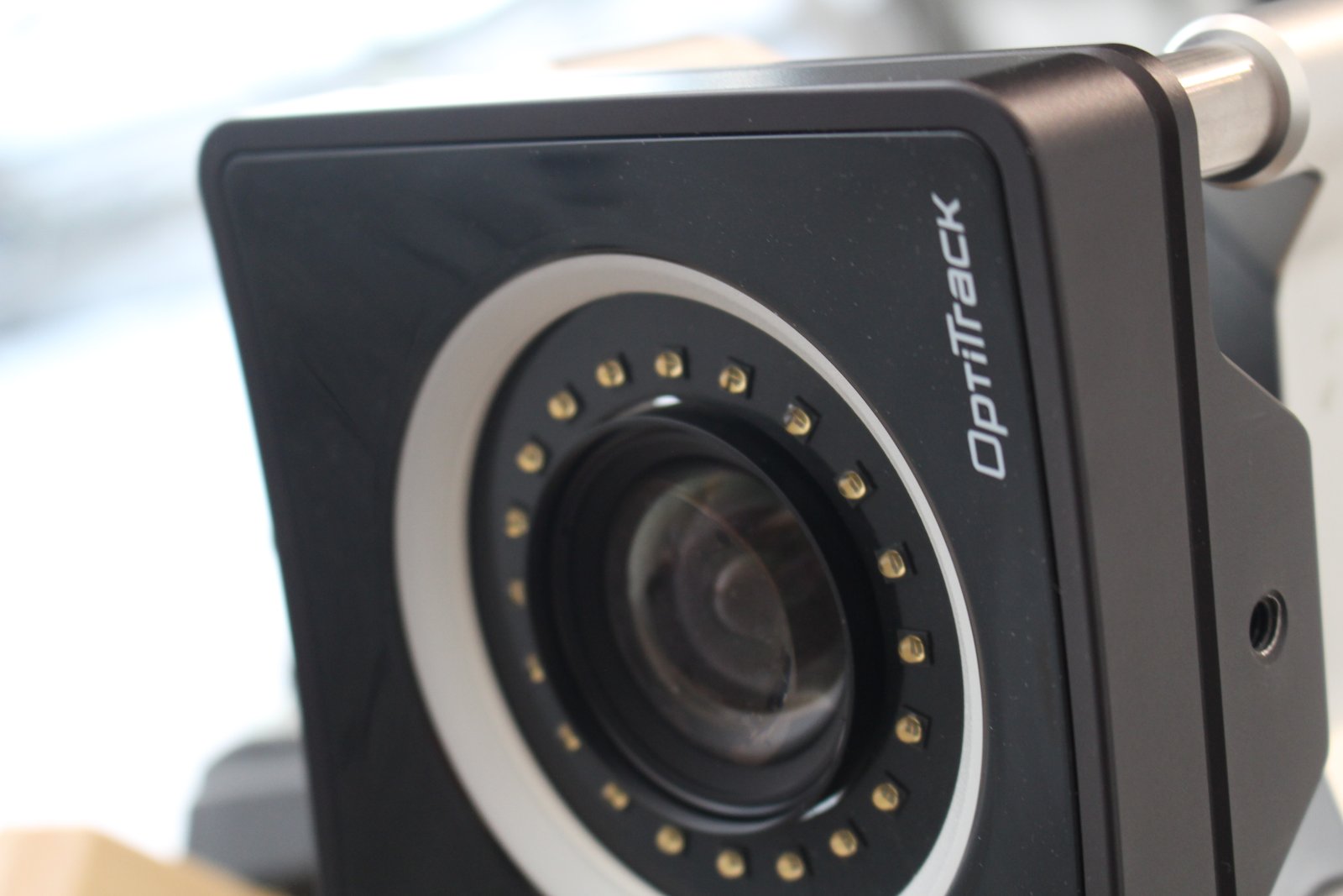 Close-up of an OptiTrack Prime 17W tracking camera mounted on a rig