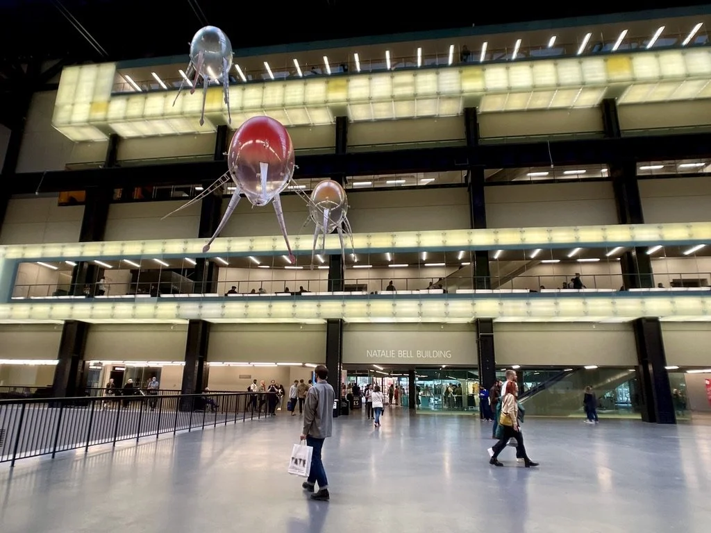 Tate Modern's Natalie Bell Building entrance, with aerobes visible through the Turbine Hall windows above